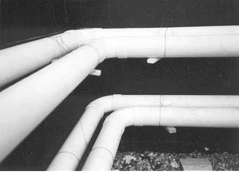 Here's a close-up of a set of geothermal earthtubes being laid around an inside corner.