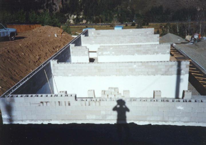 Dry stack concrete block walls using surface bonding cement instead of mortar are easy to build without special skills.