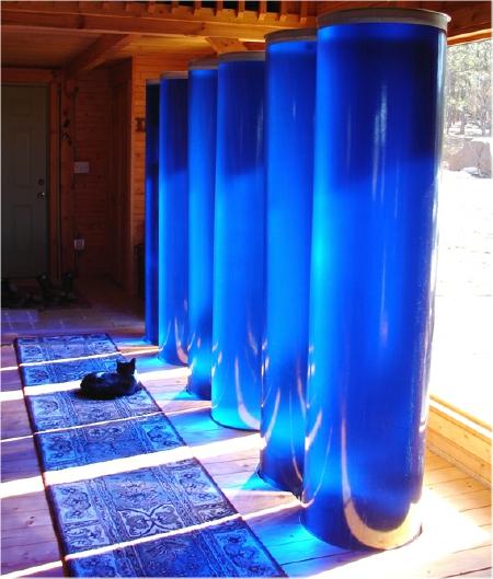 waterTubeBlue2 Heat storage tubes in a classic Trombe wall installation. Anti-tipping framework at top is recommended.