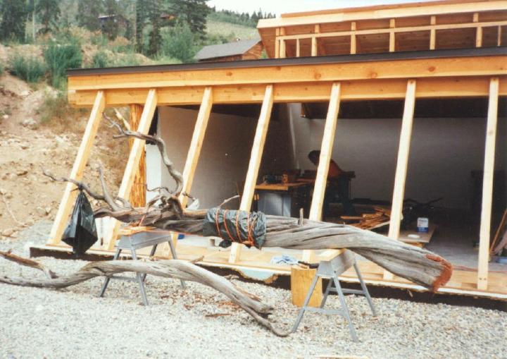 htmglassframe South face of HTM with sloped 4by6 timbers awaiting greenhouse style glass for the interior planterbed