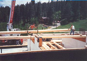 logroof3 While options exist to using a crane, the speed of construction and less chance of injury are key benefits