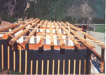 logroof4 Once logs are in place, level is notched at wall and logs are dogged in place for safety and final adjustments
