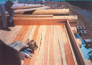 2by6 Douglas Fir tongue and groove decking boxed-in with perimeter 2by10s is very efficient for building