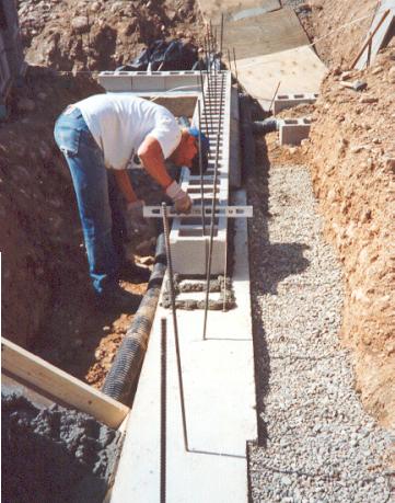 Concrete block is then perfectly leveled, as this is the start of building without mortar between courses